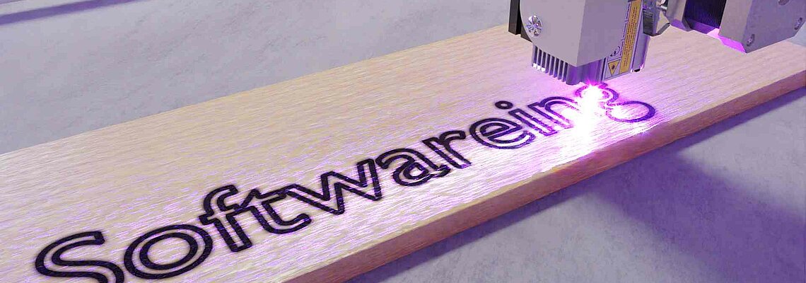 Virtual laser engraves the last letter of - Softwareing - into a wooden board.