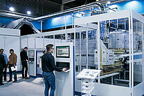 User at HMI in front of a machine cabin